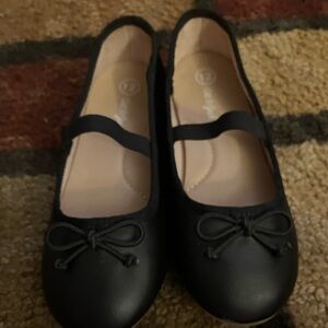 Pair of slightly worn size kids 12 cat and jack shoes.